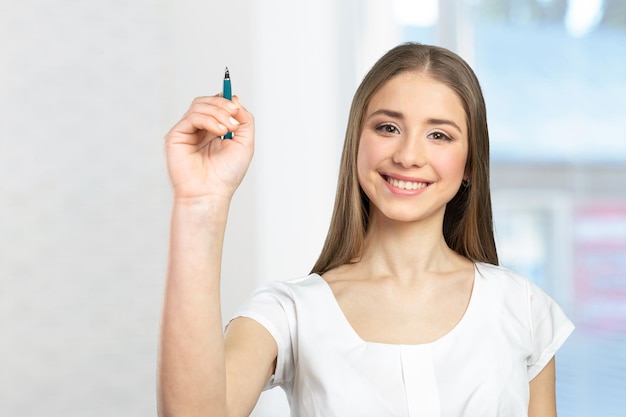 Beautiful happy smiling woman showing copy space