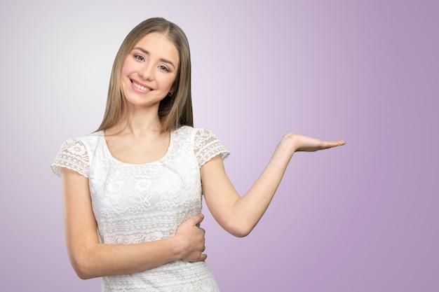 Beautiful happy smiling woman showing copy space