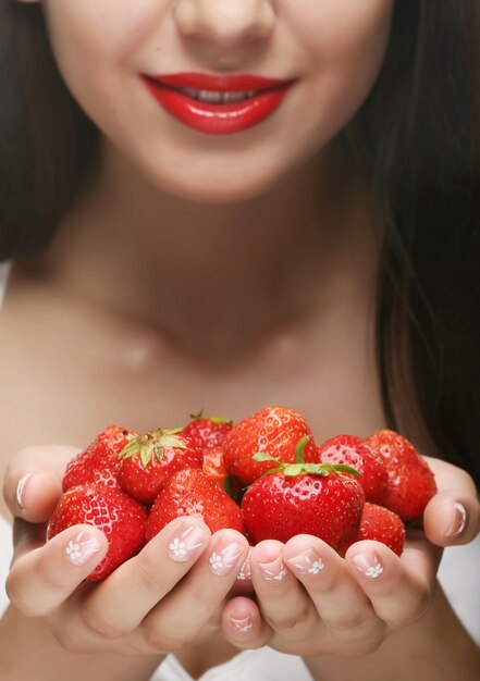 beautiful happy smiling woman with strawberry