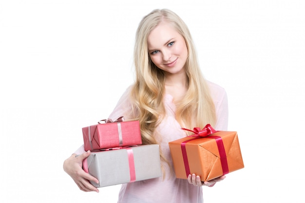 Beautiful happy woman holding gift boxes