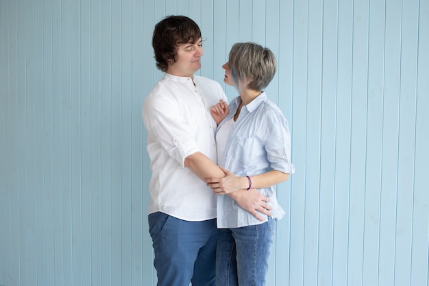 Beautiful and happy young couple in love hugging