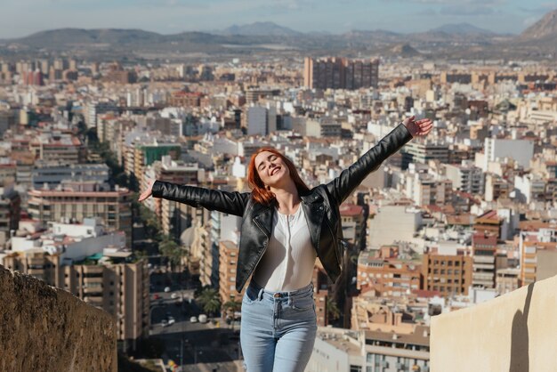 Beautiful Happy and Young Woman Enjoys the Views of the City