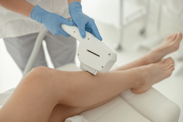 Beautiful healthy smiling caucasian woman is doing beauty procedures at spa and healthcare salon