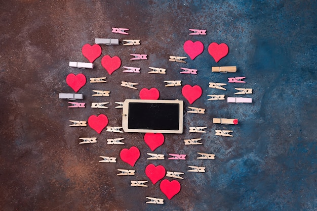 Beautiful heart made of clothespins with a chalk board 