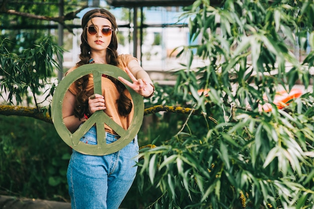 Beautiful hippie girl near tree