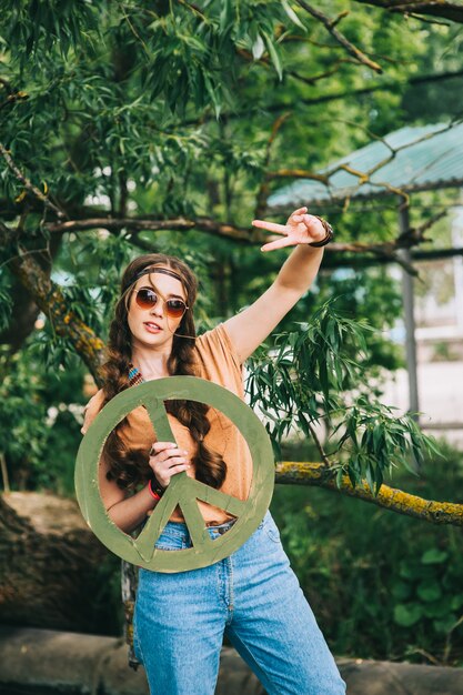 Beautiful hippie girl near tree