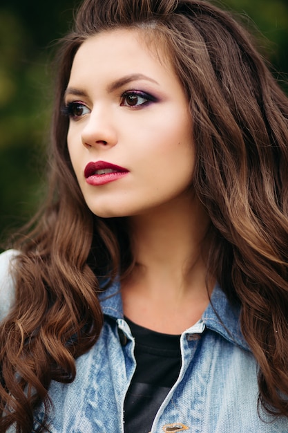 Beautiful hipster girl walking at street and posing.