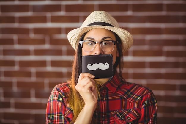 Photo beautiful hipster with mustache on wallet