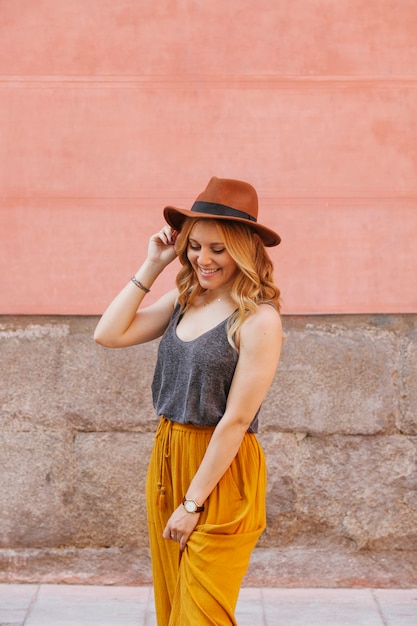 Beautiful hipster woman with a hat and fashion clothes