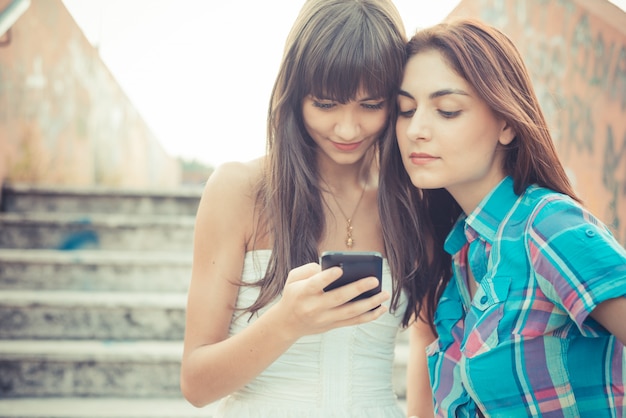 beautiful hipster young women sisters friends