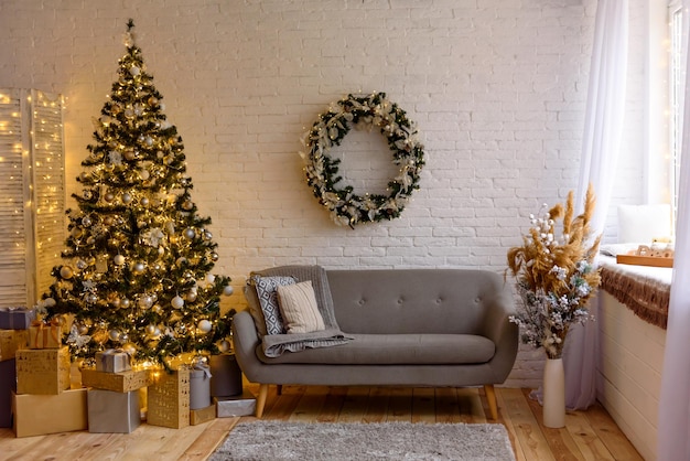 Beautiful holdiay decorated room with Christmas tree with presents under it