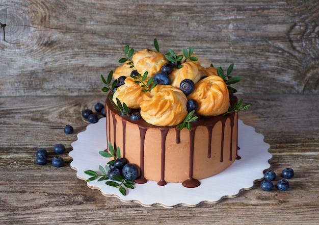 beautiful homemade cake with profiteroles