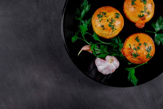 Beautiful homemade meat with garlic pies on wooden gray boards