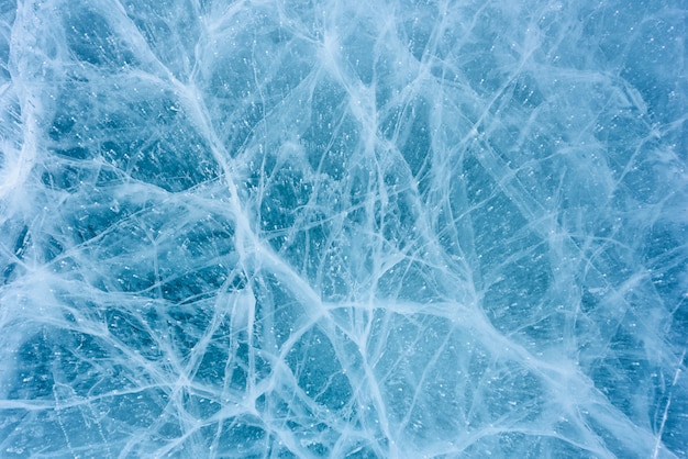 Beautiful ice of Lake Baikal with abstract cracks