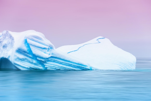 Beautiful iceberg in the Atlantic ocean at sunset. Ilulissat ice fjord, western Greenland