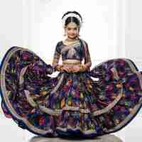 Photo a beautiful indian girl in a colorful long dress with stylish pose