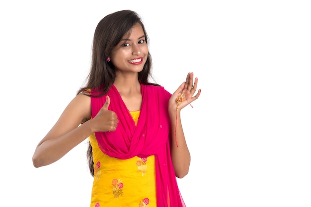 Photo beautiful indian girl showing rakhis on occasion of raksha bandhan