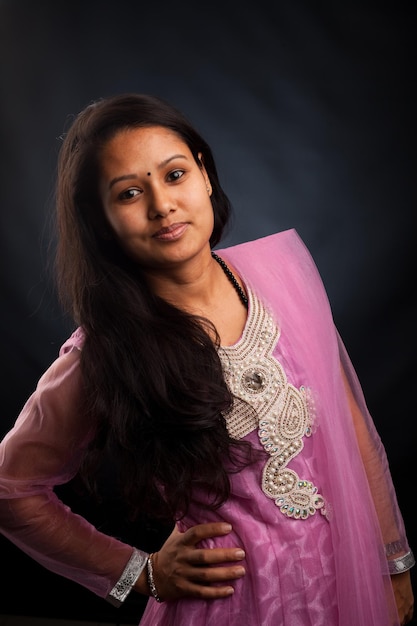 Beautiful indian girl in the studio posing and looking at the camera