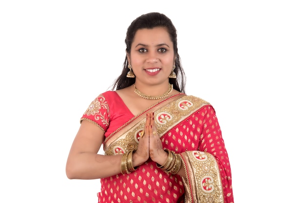 Beautiful Indian girl in a tradition sari with welcome