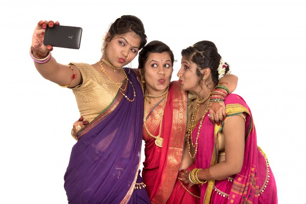 Beautiful Indian women in a saree traditional costumes