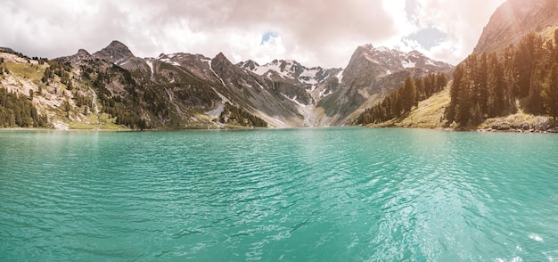 A beautiful and inspiring landscape with an idyllic mountain lake during a colorful sunset in the wilderness