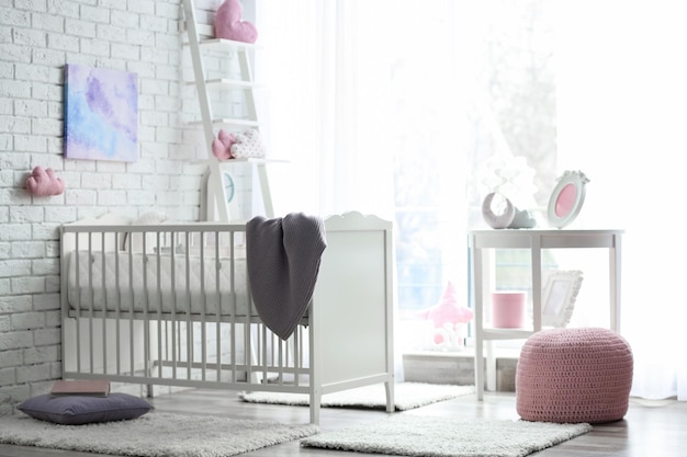 Photo beautiful interior of baby room with crib