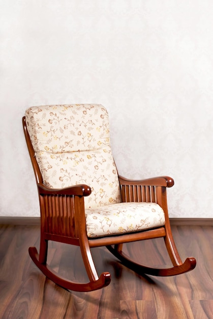 Beautiful interior Comfortable Modern rocking chair near a light wall