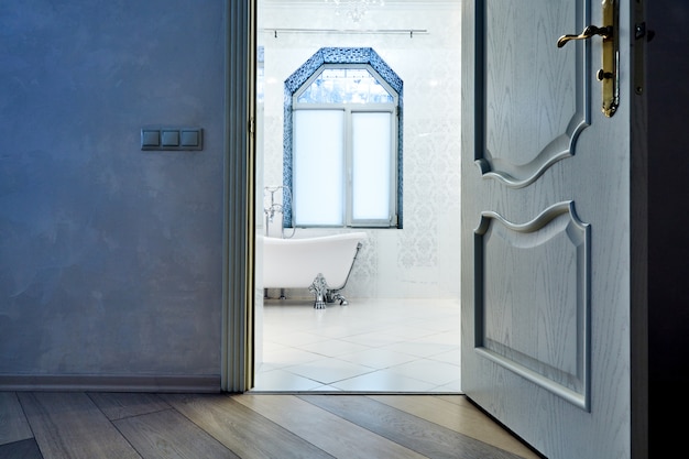 Beautiful Interiora Modern Bathroom. Interior Architecture. View through open doors