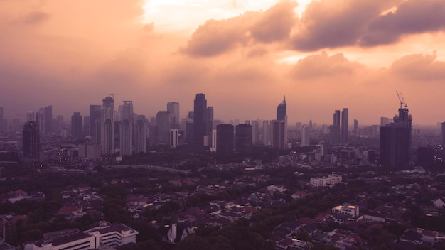 Photo beautiful jakarta cityscape under orange sky