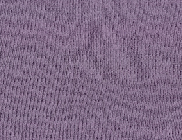 Beautiful knitted purple plum colored wool textiles as a background