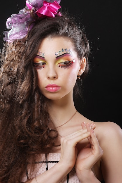 Beautiful lady with artistic make-up.