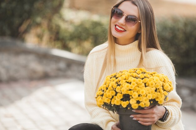 Beautiful lady with yellow flowers