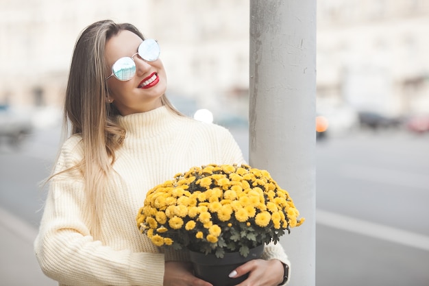 Beautiful lady with yellow flowers