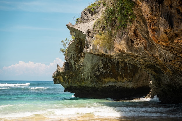 Beautiful landscape of crystal sea water and big rock stock photo