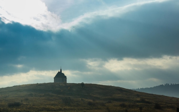 Beautiful landscape dramatic view of a lonely church on a hill somewhere in Slovakia