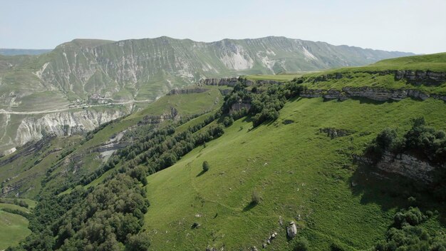 Beautiful landscape of green mountains on sunny day action top view of green mountains with rocks on