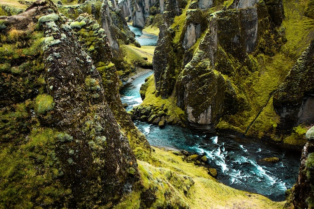 Beautiful landscape image of Iceland with mountains blue sky and green grass