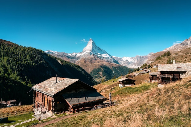 Beautiful landscape of Matterhorn mountain Swiss alps over mountain huts on the hill in autumn at Findeln Zermatt Switzerland