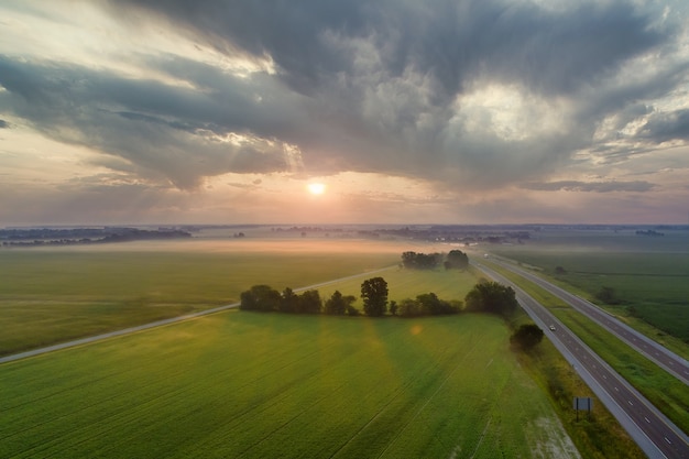 Beautiful landscape meadow mist sunrise sky with mist of fog in morning