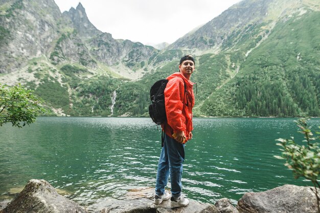 Beautiful landscape of mountain and lake with man