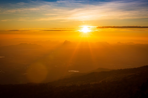 Beautiful landscape nature in morning on peak mountain with sunlight cloud fog and bright blue sky