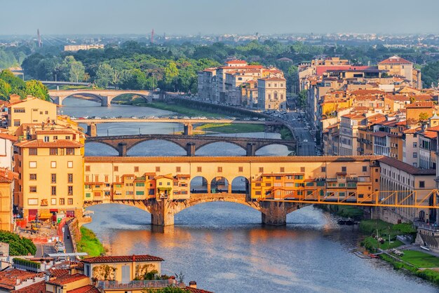 Beautiful landscape above panorama on historical view of the florence from piazzale michelangelo point ponte vecchio is a bridge in florence located at the narrowest point of the arno river