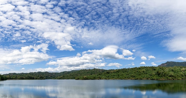 Beautiful landscape reservoir and mountain reflection of cloud on blue sky background landscape Thailand