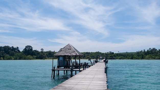 Beautiful landscape view wooden bridge and blue sea Koh mak Thailand