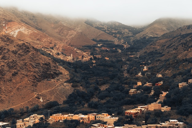 The beautiful landscape with atlas mountains in Morocco with little village below