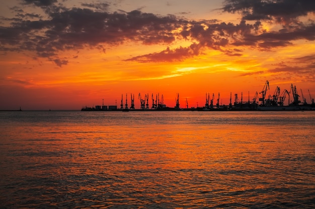 Beautiful landscape with fiery sunset sky and sea.  