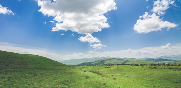 Beautiful landscape with green mountains and magnificent cloudy sky exploring armenia