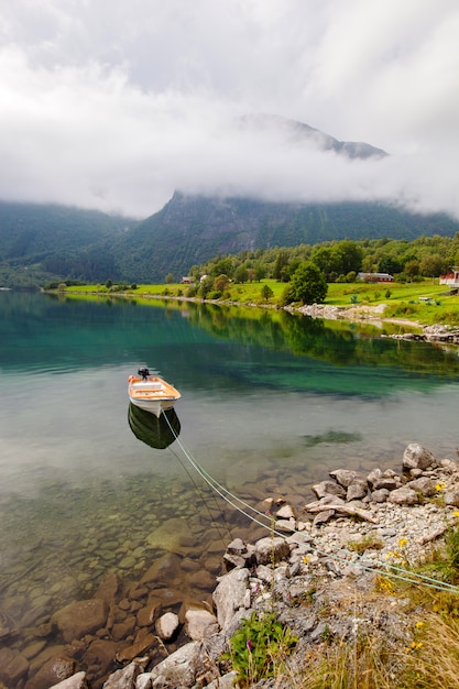 Beautiful landscape with lake and boat in Norway