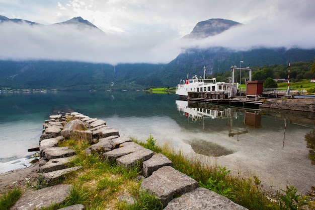 Beautiful landscape with lake and boat in Norway