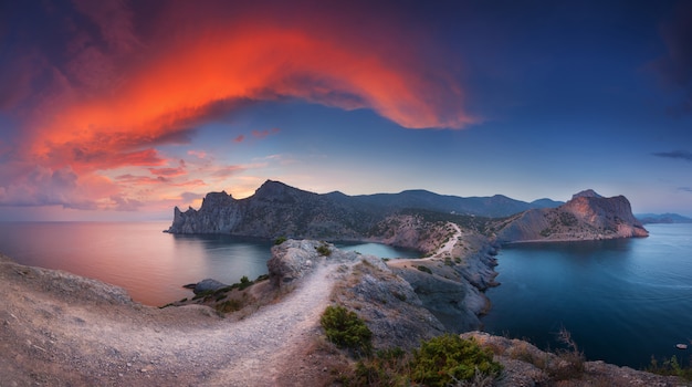 Beautiful landscape with mountains, sea at sunset